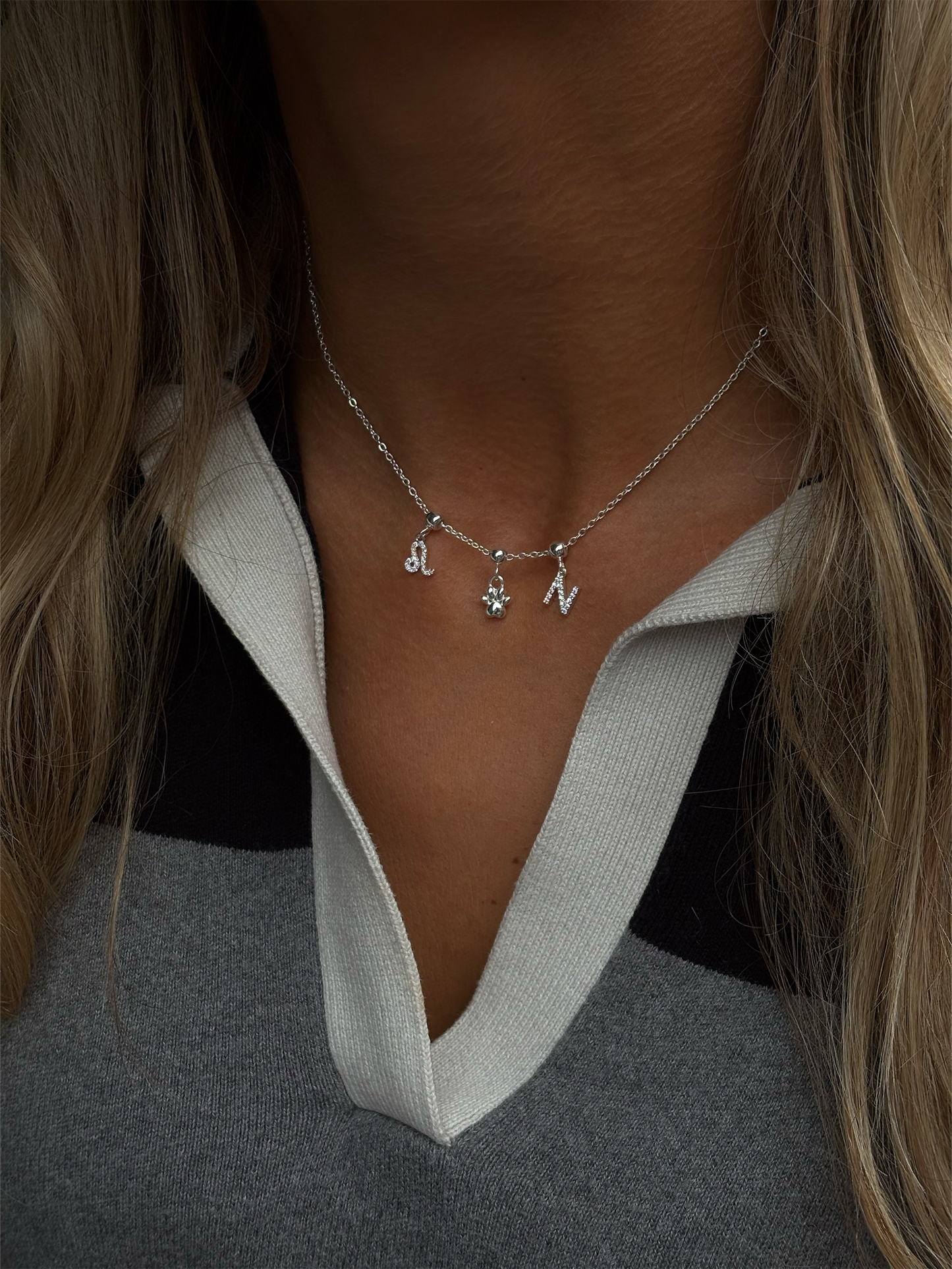 Minimal silver paw charm, perfect for dog lovers to slide and stack.